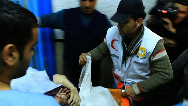 Gaza hospital staff aiding the wounded.