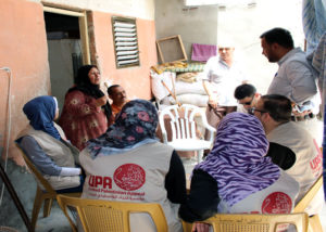 MHPs visited with beneficiaries while delivering food packages.