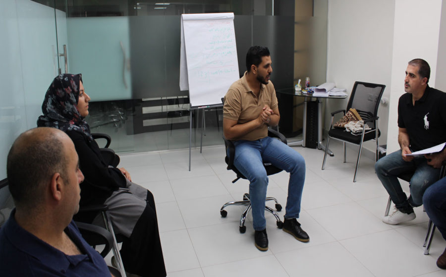 Fathers listen in during a Healing Through Feeling session.