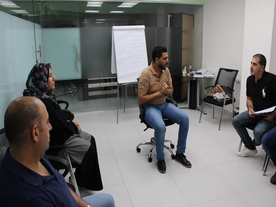 Fathers listen in during a Healing Through Feeling session.