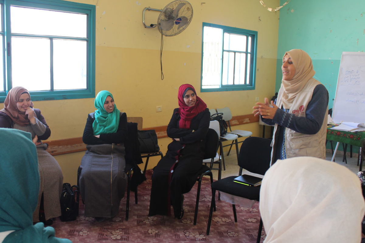 A mental health practitioner leads a group session in Gaza.