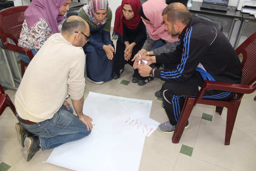 A group of teachers perform an exercise to assess trauma.