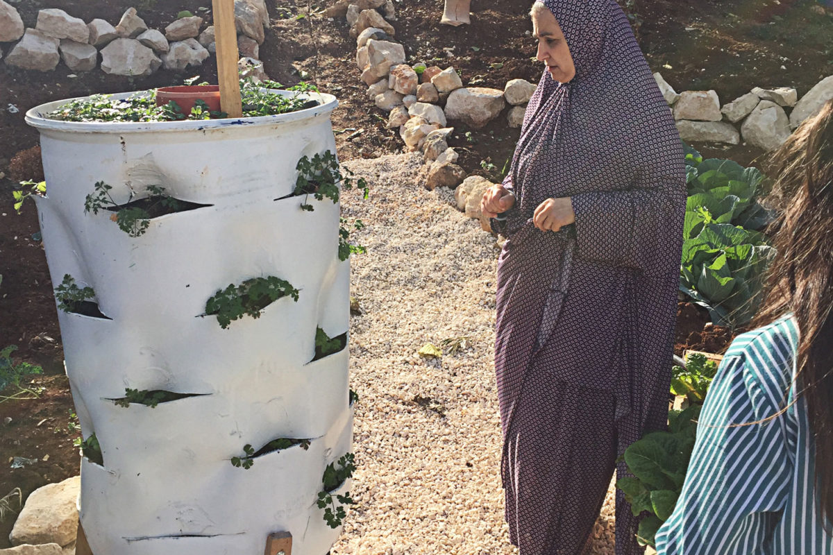 Rula tends to her garden.