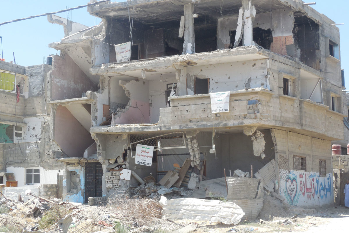 Surveying the damage in Gaza after the 2014 war.