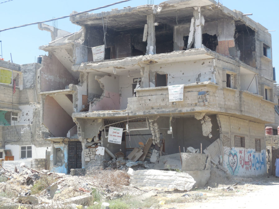 Surveying the damage in Gaza after the 2014 war.