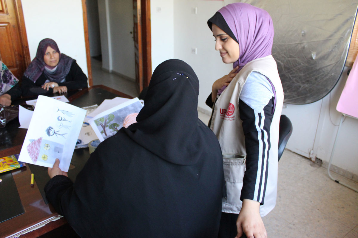 Islam approaches a parent in Gaza.