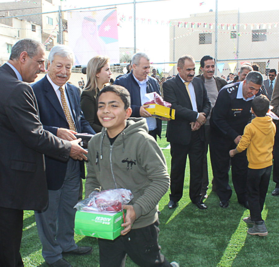 A child receives new shoes and a jersey in Hittin Camp in Jordan.