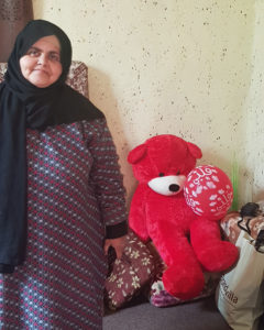 Amna with her teddy bear.