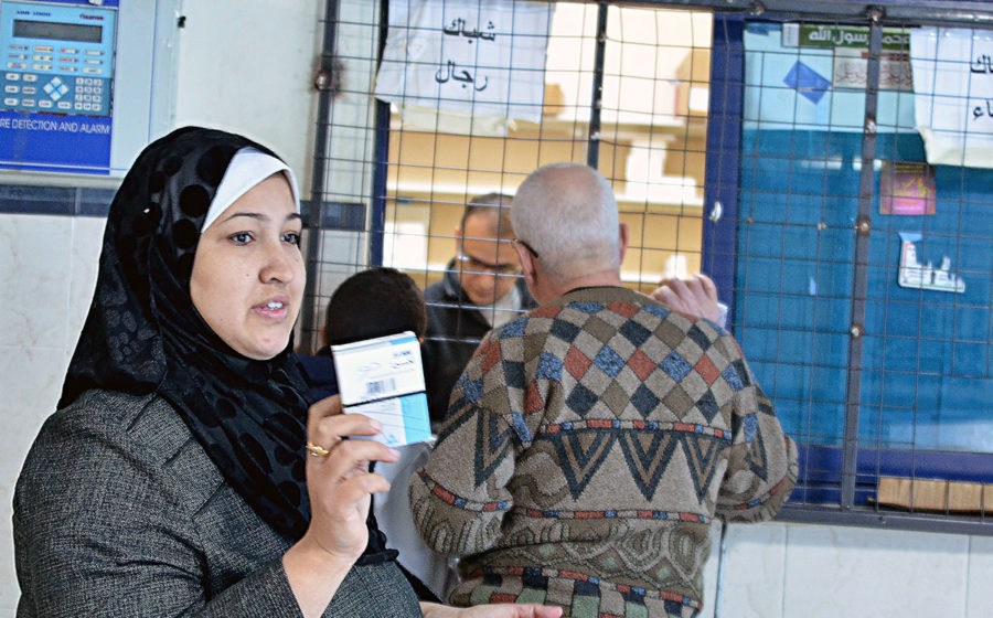 Dalia receives free medicine in Gaza.