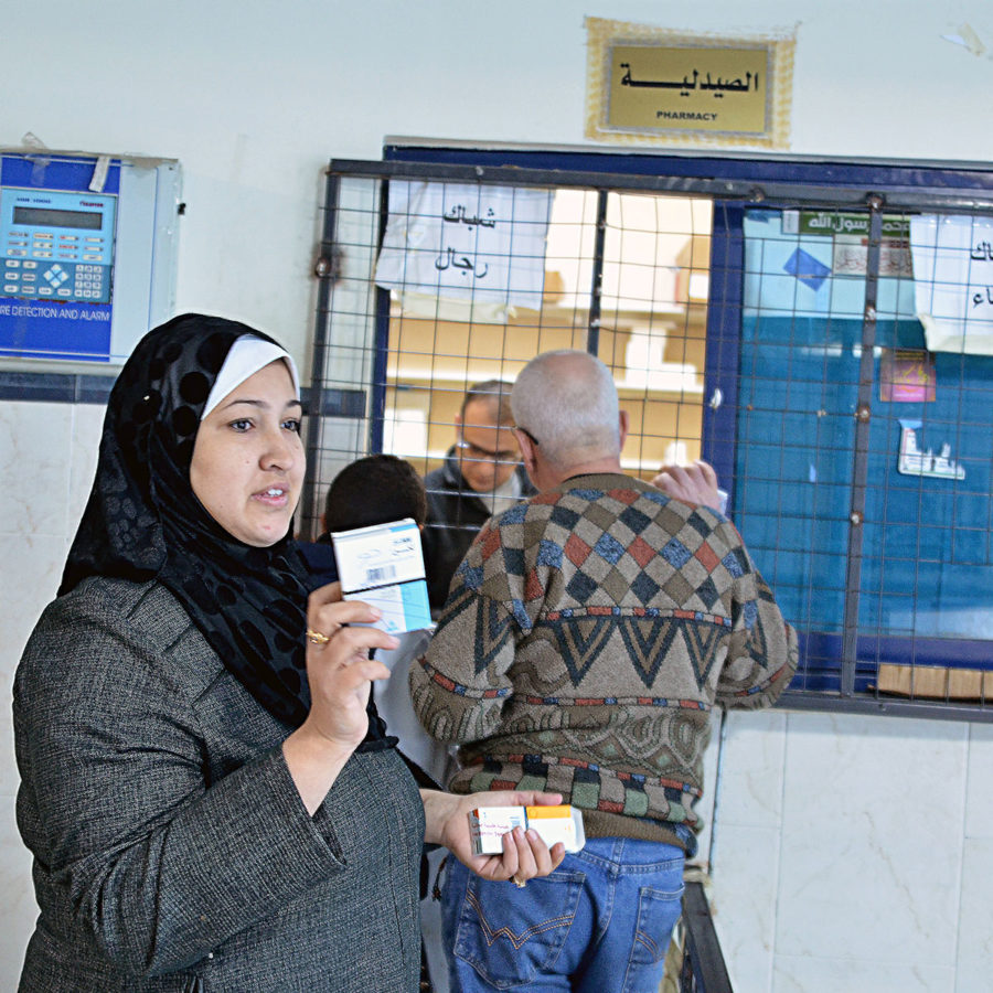 Dalia receives free medicine in Gaza.