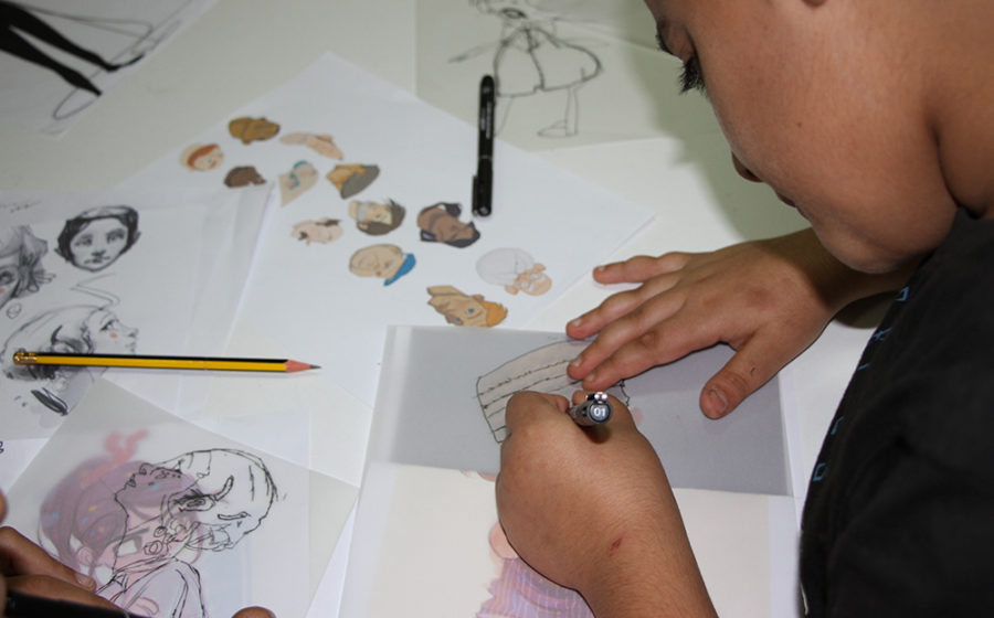 A child sketches in Lebanon.