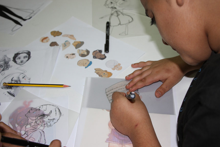 A child sketches in Lebanon.